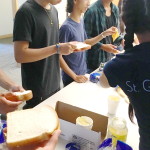 Youth holding bread for sandwich