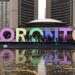 Youth group in front of Toronto sign
